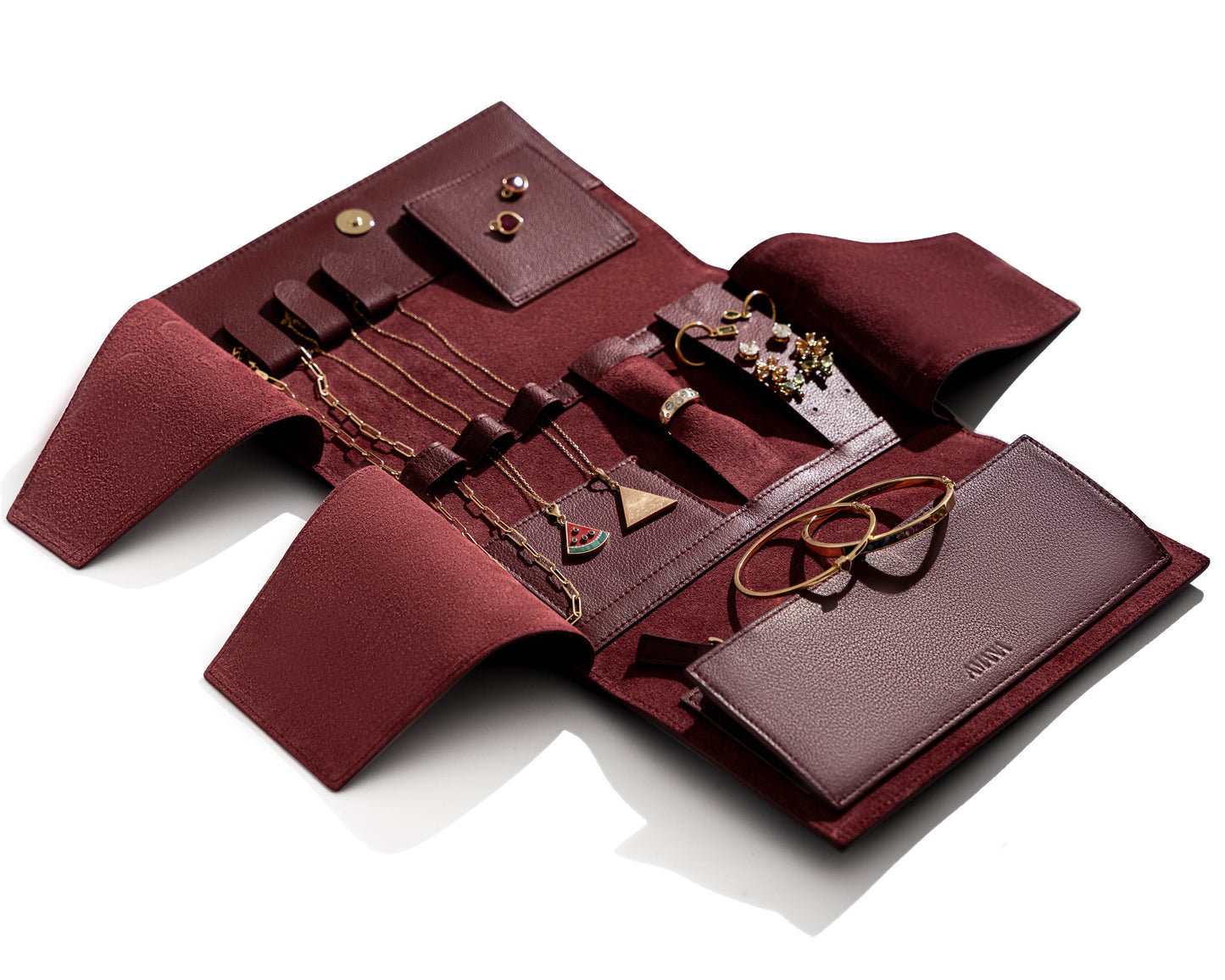Poppy jewelry wallet with rings and necklaces securely stored inside