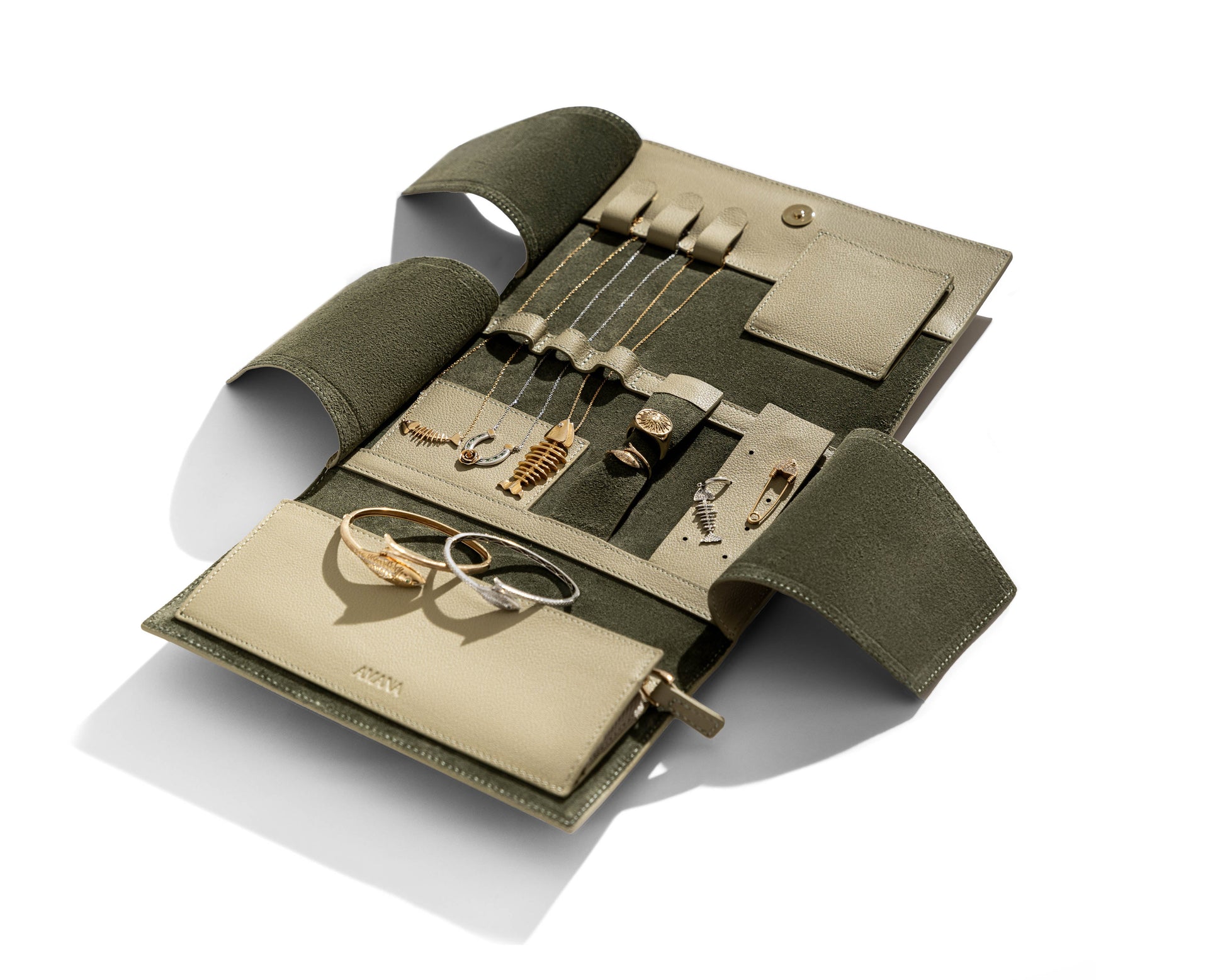 Olive jewelry wallet with rings and necklaces securely stored inside